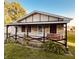 Charming single-story home featuring a quaint covered front porch with a delightful swing and tasteful landscaping at 514 W 6Th St, Sheridan, IN 46069