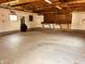 Spacious garage featuring a workbench and shelving, ready for projects and storage at 514 W 6Th St, Sheridan, IN 46069