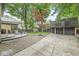Expansive backyard featuring a deck, patio, and mature trees at 518 Buckingham Dr, Indianapolis, IN 46208