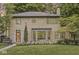 Charming brick home boasts mature trees, a landscaped yard, and unique architectural details at 518 Buckingham Dr, Indianapolis, IN 46208