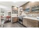 Modern kitchen features sleek cabinets, stainless steel appliances, and mosaic tile backsplash at 518 Buckingham Dr, Indianapolis, IN 46208