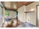 Bright sunroom with wood ceiling, brick walls, and plenty of natural light at 518 Buckingham Dr, Indianapolis, IN 46208