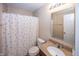 Cozy bathroom featuring a vanity with a granite countertop and a shower-tub combo at 5215 Climbing Rose Pl, Indianapolis, IN 46254