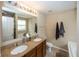 Bathroom boasts double sinks, granite countertops, and updated fixtures at 5215 Climbing Rose Pl, Indianapolis, IN 46254