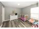A cozy Bedroom with a crib, dresser, and ample space for play at 5215 Climbing Rose Pl, Indianapolis, IN 46254