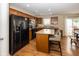 Bright kitchen with an island, stainless steel appliances, and access to the backyard at 5215 Climbing Rose Pl, Indianapolis, IN 46254