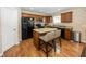 Well-equipped kitchen with granite countertops, an island with seating, and stainless steel appliances for modern living at 5215 Climbing Rose Pl, Indianapolis, IN 46254