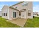 The backyard features a patio and a grassy area, creating an inviting outdoor space for relaxation and entertainment at 5767 Bluff View Ln, Whitestown, IN 46075