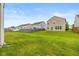 Expansive backyard showcasing a well-maintained lawn and privacy fence, perfect for outdoor activities at 5767 Bluff View Ln, Whitestown, IN 46075