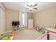 Comfortable carpeted bedroom with a ceiling fan, natural light, closet, and toys offering a cozy and playful atmosphere at 5767 Bluff View Ln, Whitestown, IN 46075