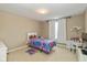 Cozy bedroom with carpet flooring, natural light, and a cute Princess-themed bed and desk to complete the space at 5767 Bluff View Ln, Whitestown, IN 46075
