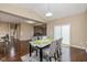 Inviting dining area with modern furnishings, hardwood floors, and access to the backyard at 5767 Bluff View Ln, Whitestown, IN 46075