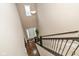 Grand foyer view from above showcases a high ceiling, hardwood floors, and a welcoming front door at 5767 Bluff View Ln, Whitestown, IN 46075