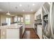Modern kitchen boasts stainless steel appliances, granite countertops, and ample cabinet space at 5767 Bluff View Ln, Whitestown, IN 46075