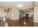 Spacious, open-concept living area with hardwood floors and neutral paint throughout the home at 5767 Bluff View Ln, Whitestown, IN 46075