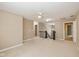 Spacious loft area with neutral carpet and walls, offering versatility for a playroom, office, or entertainment space at 5767 Bluff View Ln, Whitestown, IN 46075