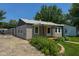 Single story home with front porch and lovely landscaping at 5866 Shimer Ave, Indianapolis, IN 46219