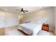 Cozy bedroom with a queen bed, ceiling fan, and natural light at 615 Orange St, Indianapolis, IN 46203