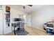 Contemporary bedroom with a sleek ceiling fan, a functional desk area, and minimalist decor at 615 Orange St, Indianapolis, IN 46203