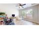 Bright bedroom features a ceiling fan, a cozy chair, and a window offering natural light at 615 Orange St, Indianapolis, IN 46203
