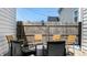 A backyard patio set with chairs and a round table around a small fire pit at 615 Orange St, Indianapolis, IN 46203
