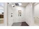 Stylish walk-in shower with marble-style tile, rainfall shower head, and niche shelving at 615 Orange St, Indianapolis, IN 46203