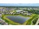 Aerial view of a neighborhood nestled around a picturesque lake, creating a serene residential setting at 6762 Brentwood Ct, Brownsburg, IN 46112