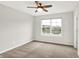 Bedroom showcasing a window with neighborhood views, carpet flooring and neutral walls at 6762 Brentwood Ct, Brownsburg, IN 46112