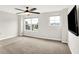 Bright bedroom with plush carpet and windows offering neighborhood views at 6762 Brentwood Ct, Brownsburg, IN 46112