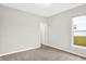 Neutral bedroom with a window and carpeted flooring at 6762 Brentwood Ct, Brownsburg, IN 46112