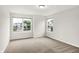 Bright bedroom with two windows providing natural light and views of the neighborhood at 6762 Brentwood Ct, Brownsburg, IN 46112