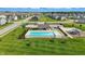 Community pool and play area offering a recreational space for relaxation and Gathering fun at 6762 Brentwood Ct, Brownsburg, IN 46112
