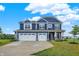 Beautiful two-story home with three-car garage and lovely landscaping at 6762 Brentwood Ct, Brownsburg, IN 46112