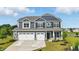 Beautiful two-story home with a three-car garage and manicured lawn, perfect for Gathering living at 6762 Brentwood Ct, Brownsburg, IN 46112