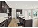 Bright, updated kitchen with stainless steel appliances, hardwood floors, and a large island at 6762 Brentwood Ct, Brownsburg, IN 46112