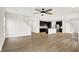 Open concept living room and kitchen area with hard wood floors and a ceiling fan at 6762 Brentwood Ct, Brownsburg, IN 46112