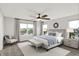 A bedroom with water views, fan, wood flooring and decorative lamps and pillows at 6762 Brentwood Ct, Brownsburg, IN 46112