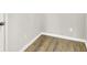 Neutral-toned room with wood-look flooring and white trim at 6762 Brentwood Ct, Brownsburg, IN 46112