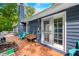 Cozy back deck with wood flooring and blue siding, perfect for outdoor relaxation and container gardening at 6933 Grey Wolf Dr, , IN 46164