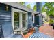 Comfortable back deck with chairs, table, and sliding glass doors to the house at 6933 Grey Wolf Dr, , IN 46164