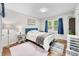 Bright bedroom with a comfortable bed, wood floors, and natural light at 6933 Grey Wolf Dr, , IN 46164
