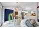 A dining area is well-lit with a modern light fixture and opens to the kitchen at 6933 Grey Wolf Dr, , IN 46164