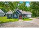 Attractive blue house features a front porch and attached garage surrounded by mature trees at 6933 Grey Wolf Dr, , IN 46164