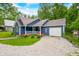 Charming blue cottage-style home with a front porch and an attached single-car garage at 6933 Grey Wolf Dr, , IN 46164