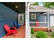Inviting front porch with colorful seating and a view of the well-maintained yard at 6933 Grey Wolf Dr, , IN 46164