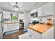 Well-lit kitchen with white cabinets, butcher block countertops, and stainless steel appliances at 6933 Grey Wolf Dr, , IN 46164