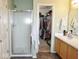 Bathroom featuring a shower and large closet, blending convenience with practical storage solutions at 7042 Gavin Dr, Indianapolis, IN 46217