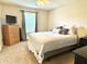 Bright bedroom featuring a comfortable bed, dresser and a well lit window at 7042 Gavin Dr, Indianapolis, IN 46217