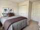 Cozy bedroom with a comfortable bed, neutral tones and a closet for ample storage at 7042 Gavin Dr, Indianapolis, IN 46217