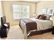 Well-lit bedroom with comfortable bed and large window offering natural light at 7042 Gavin Dr, Indianapolis, IN 46217